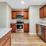 Wooden Finish Redesigned Kitchen with Appliances