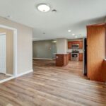 Extended Interior View of Kitchen, Floor, Room, and Lights on Ceiling