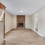 Straight View of the Brick Style Fireplace and A Big Light Above